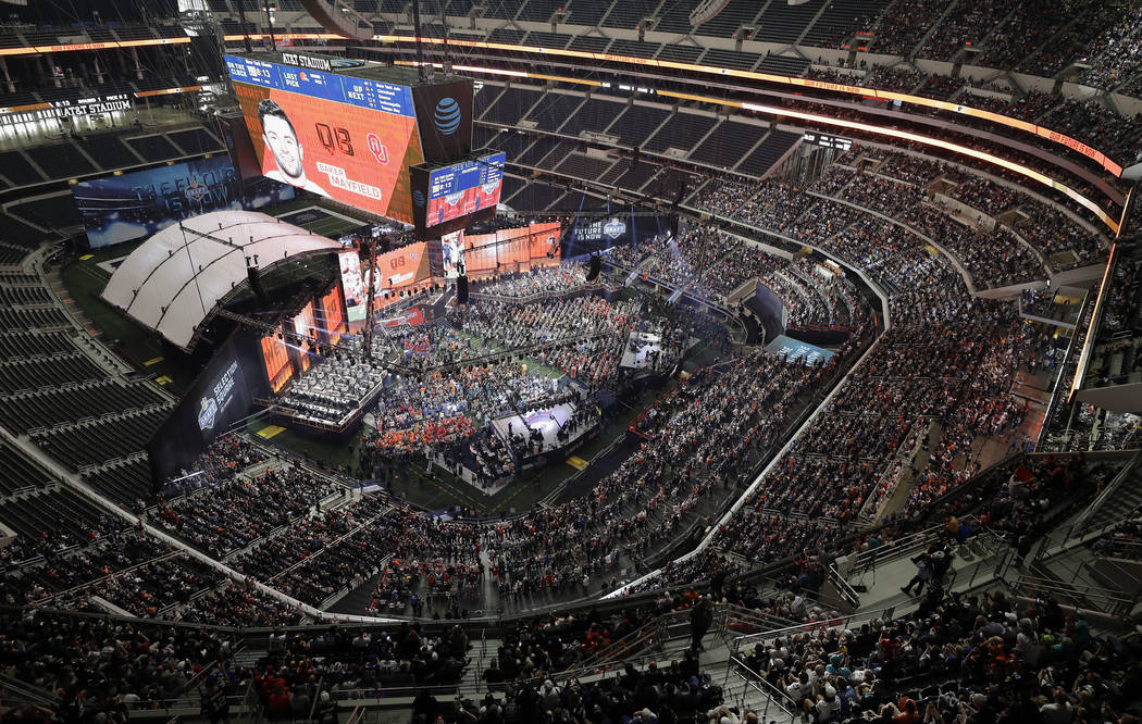 In this April 26, 2018 file photo, Oklahoma's Baker Mayfield appears on the video screen after being picked by the Cleveland Browns during the first round of the NFL football draft in Arlington, T ...