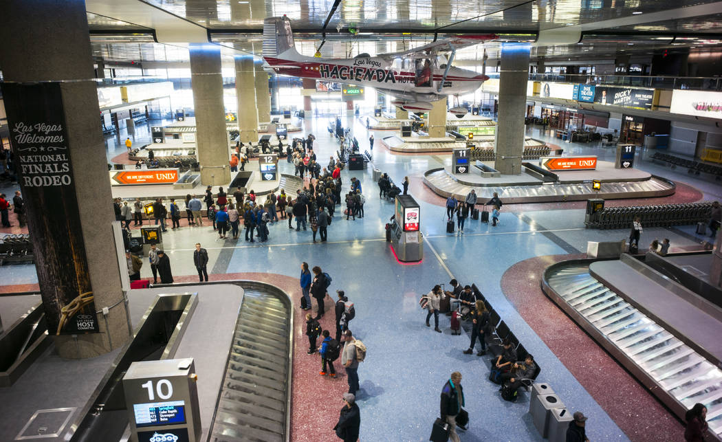 A 1958 Cessna 172 single-engine plane, part of the Howard W. Cannon Aviation Museum, hangs over the baggage claim at McCarran International Airport in Las Vegas on Tuesday, Dec. 26, 2017. Chase St ...