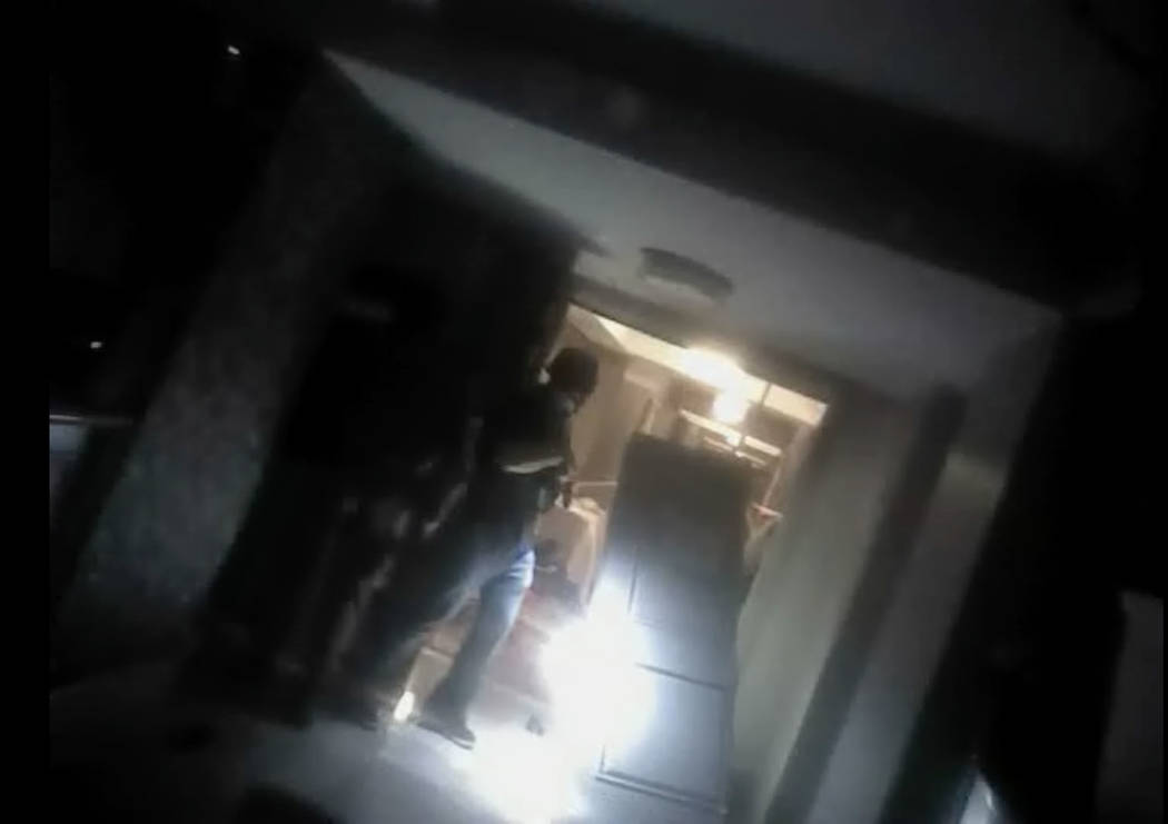 This screen grab from body camera footage released by Las Vegas police, Wednesday, May 2, 2018, shows the moment officers breached the Oct. 1 gunmanճ Mandalay Bay suite. Metropolitan Police ...