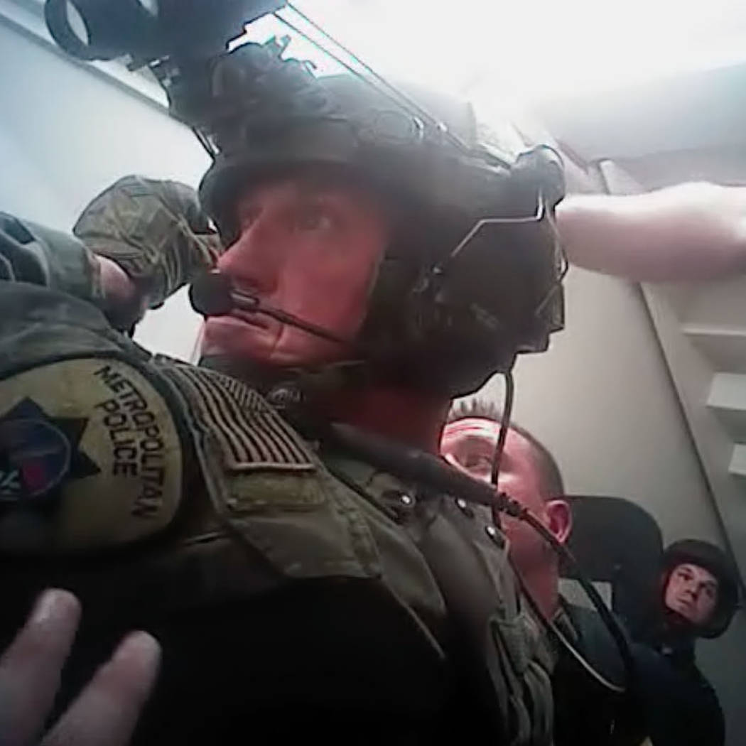 This screen grab from body camera footage released by Las Vegas police, Wednesday, May 2, 2018, shows the moment officers breached the Oct. 1 gunman's Mandalay Bay suite. Metropolitan Police Depar ...