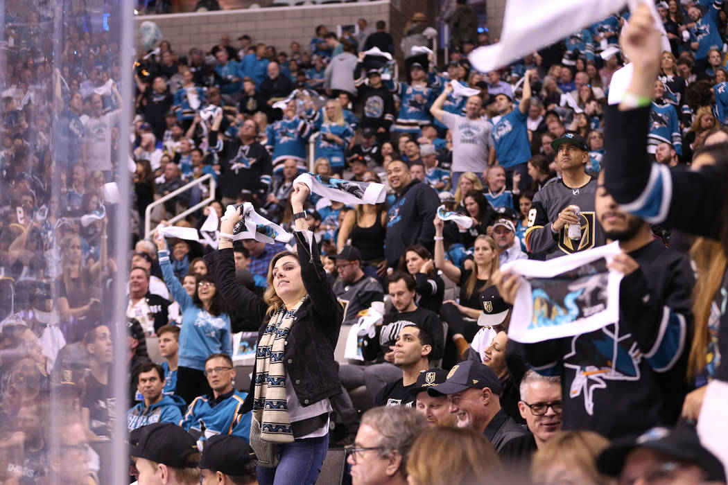 Fans celebrate a score by the San Jose Sharks against the Vegas Golden Knights during the first period in Game 4 of an NHL hockey second-round playoff series at the SAP Center in San Jose, Calif, ...