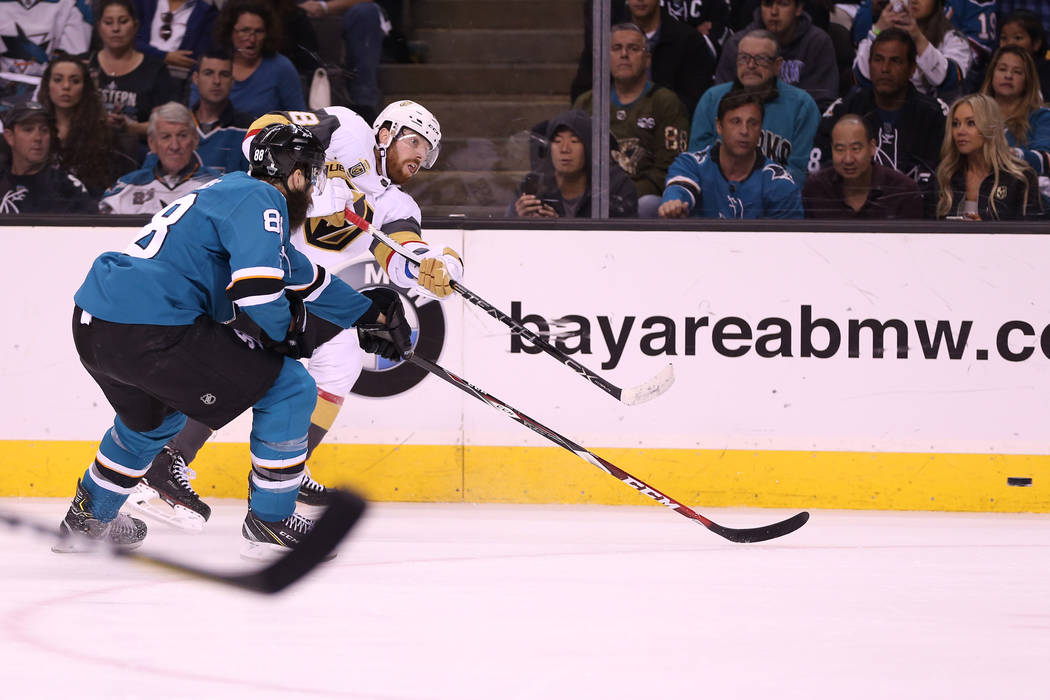 Vegas Golden Knights left wing James Neal (18) makes a shot against pressure from San Jose Sharks defenseman Brent Burns (88) during the first period in Game 4 of an NHL hockey second-round playof ...