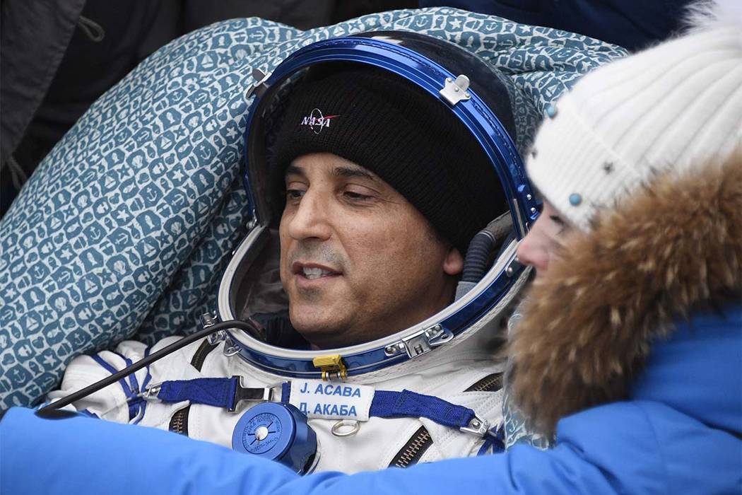 In this Feb. 28, 2018 file photo NASA astronaut Joe Acaba rests in a chair after landing in a remote area south-east of the Kazakh town of Zhezkazgan, Kazakhstan. (Alexander Nemenov/Pool Photo vi ...