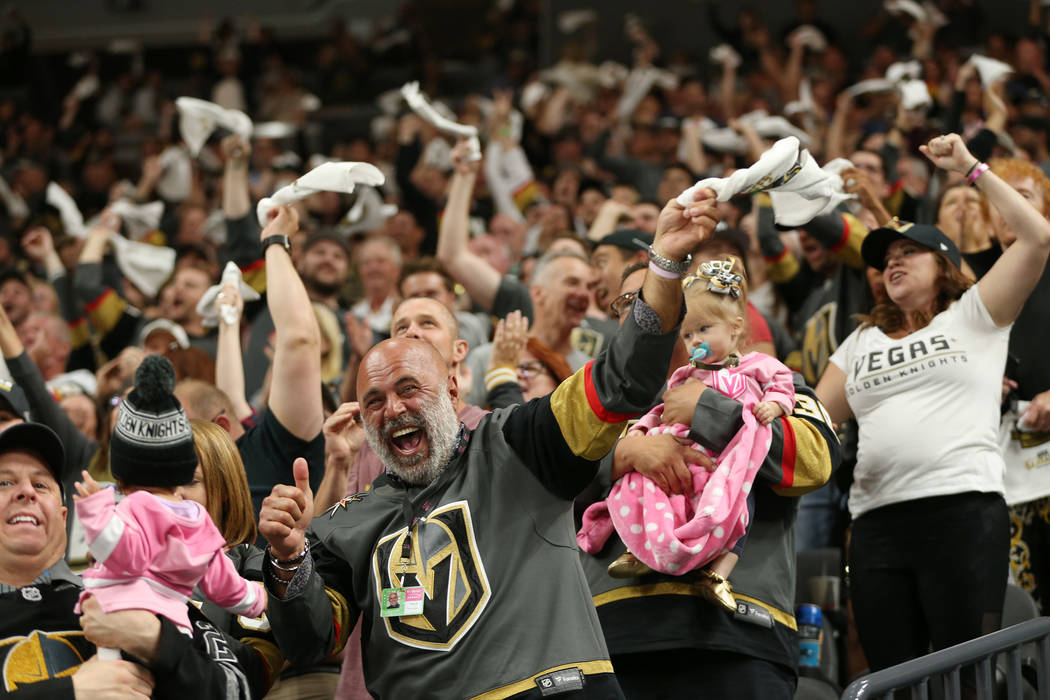 Vegas Golden Knights fans celebrates a score during the first period in Game 1 of an NHL hockey second-round playoff series at T-Mobile Arena in Las Vegas in Las Vegas, Thursday, April 26, 2018. E ...