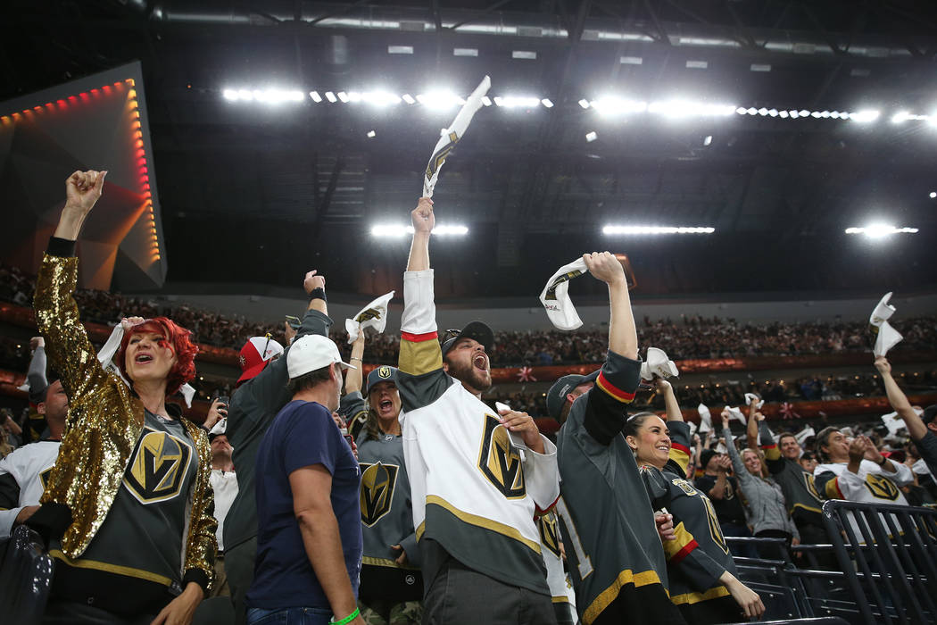 Vegas Golden Knights fans celebrates a score during the first period in Game 1 of an NHL hockey second-round playoff series at T-Mobile Arena in Las Vegas in Las Vegas, Thursday, April 26, 2018. E ...