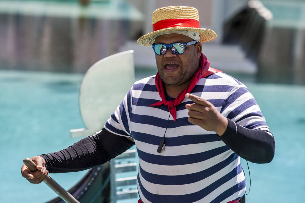 Golden Knights national anthem singer Carnell Johnson, also known as "Golden Pipes," sings for Scottish visitors on a gondola ride outside the Venetian in Las Vegas on Thursday, May 3, 2 ...