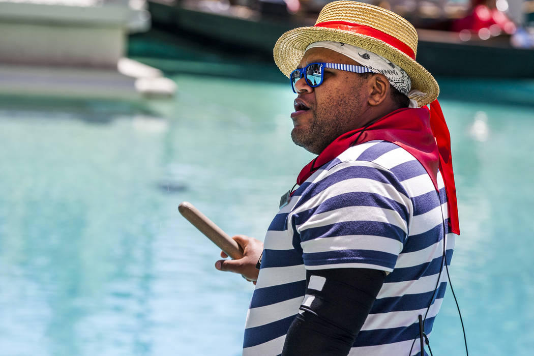 Golden Knights national anthem singer Carnell Johnson, also known as "Golden Pipes," sings for Scottish visitors on a gondola ride outside the Venetian in Las Vegas on Thursday, May 3, 2 ...