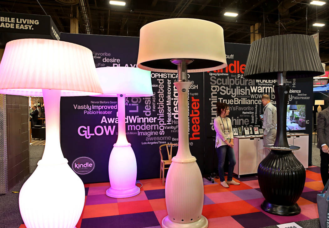 Giant outdoor lamps and outdoor heaters are displayed at KindleLiving's booth during the 2018 Hospitality Design Exposition and Conference on Wednesday, May 2, 2018, in Las Vegas. Bizuayehu Tesfay ...