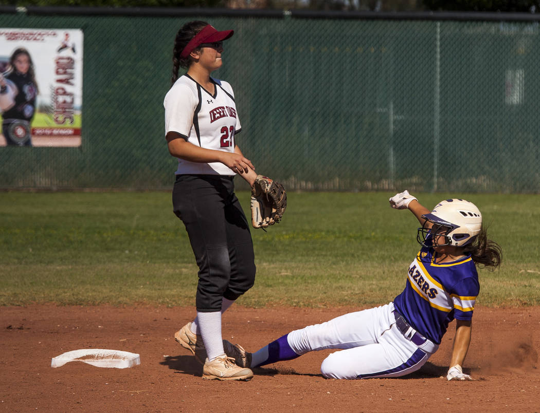Durango infielder Destiny Cisneros slides in safe at second as Desert Oasis infielder Makayla Rickard waits for a play in the second inning at Desert Oasis High School in Las Vegas on Thursday, Ma ...