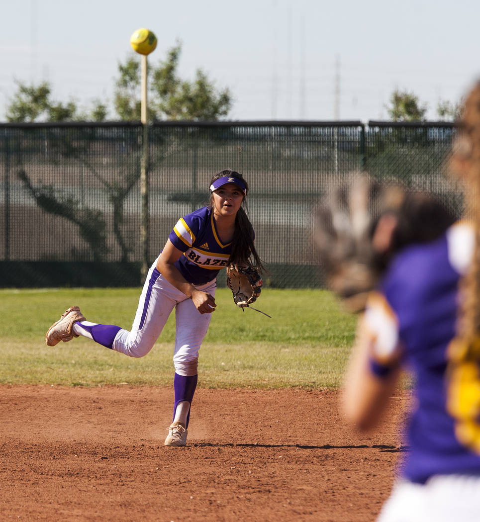 Durango infielder Destiny Cisneros throws toward Madison Boyce at first base to make a play against Desert Oasis during the third inning at Desert Oasis High School in Las Vegas on Thursday, May 3 ...