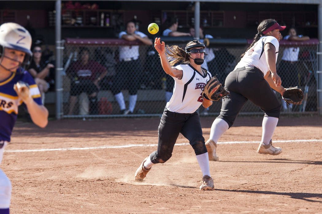 Desert Oasis pitcher Alexus Marquez looks to make a play at first base while Durango's Isabel Perez runs toward first in the fourth inning at Desert Oasis High School in Las Vegas on Thursday, May ...