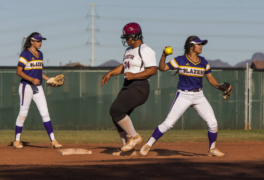 Durango infielder Destiny Cisneros looks for a play at first after tagging Desert Oasis' Fia Tofi out at second in the sixth inning at Desert Oasis High School in Las Vegas on Thursday, May 3, 201 ...