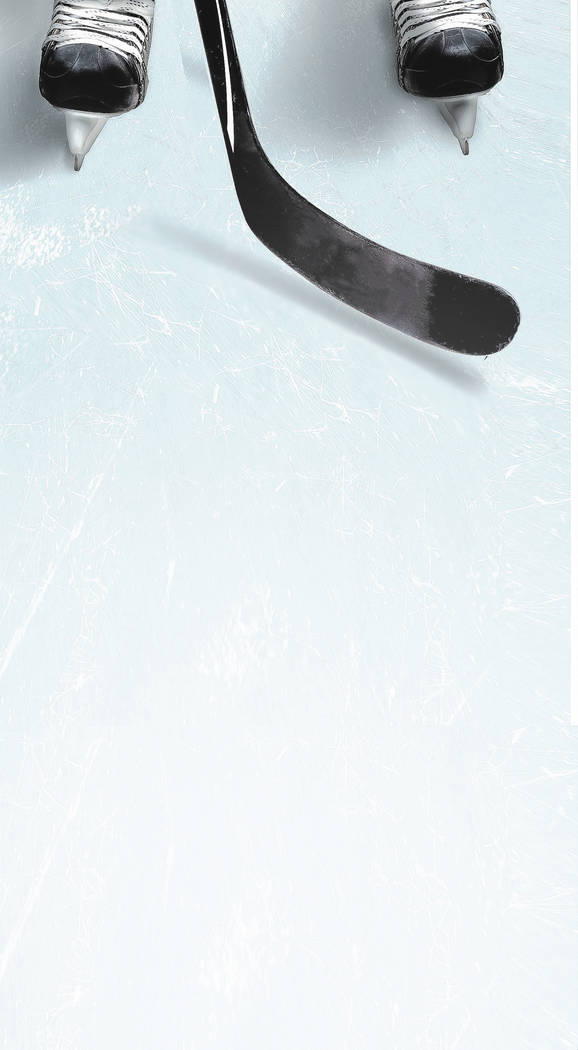Hockey stick and puck on ice with a player's skates showing partically and copy space. Vertical orientation.