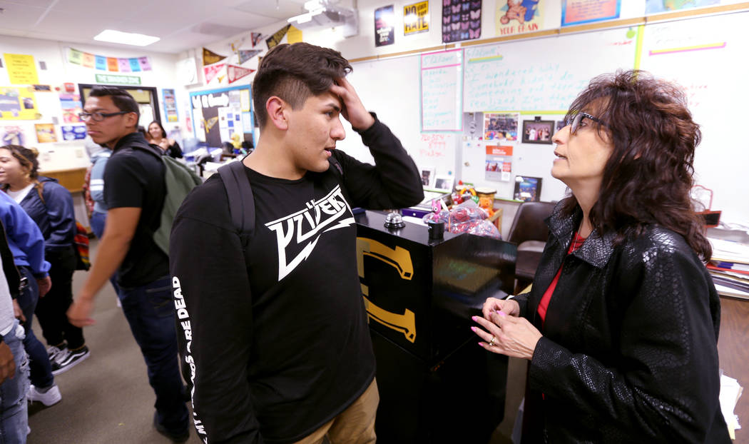Clark High School teacher Luanne Wagner talks to senior Brandon Cera before a meeting of the KEEN Club Wednesday, May 2, 2018. Wagner is the club advisor for Keeping Everyone's Eyes on the Neighbo ...