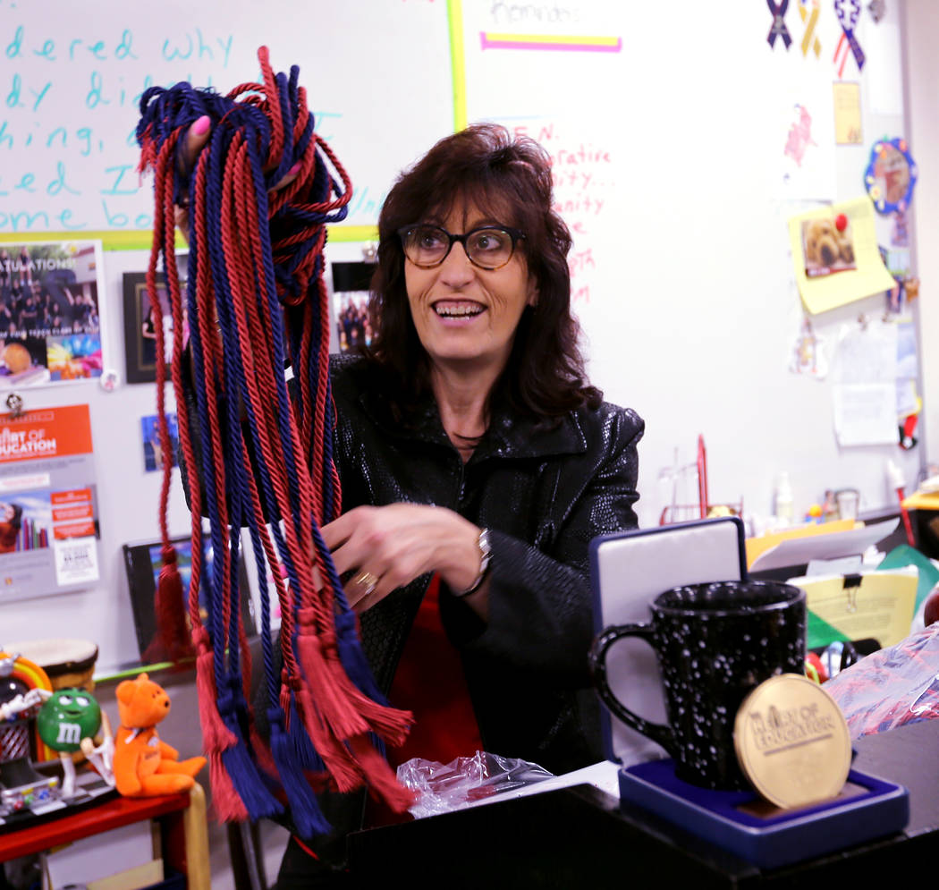 Clark High School teacher Luanne Wagner shows graduation cords before a meeting of the KEEN Club Wednesday, May 2, 2018. Wagner is the club advisor for Keeping Everyone's Eyes on the Neighborhood, ...