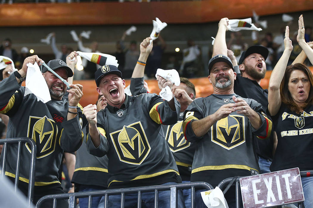 Golden Knights fans celebrate a goal by Golden Knights center William Karlsson, not pictured, during the first period of Game 2 of an NHL hockey second-round playoff series against the San Jose Sh ...