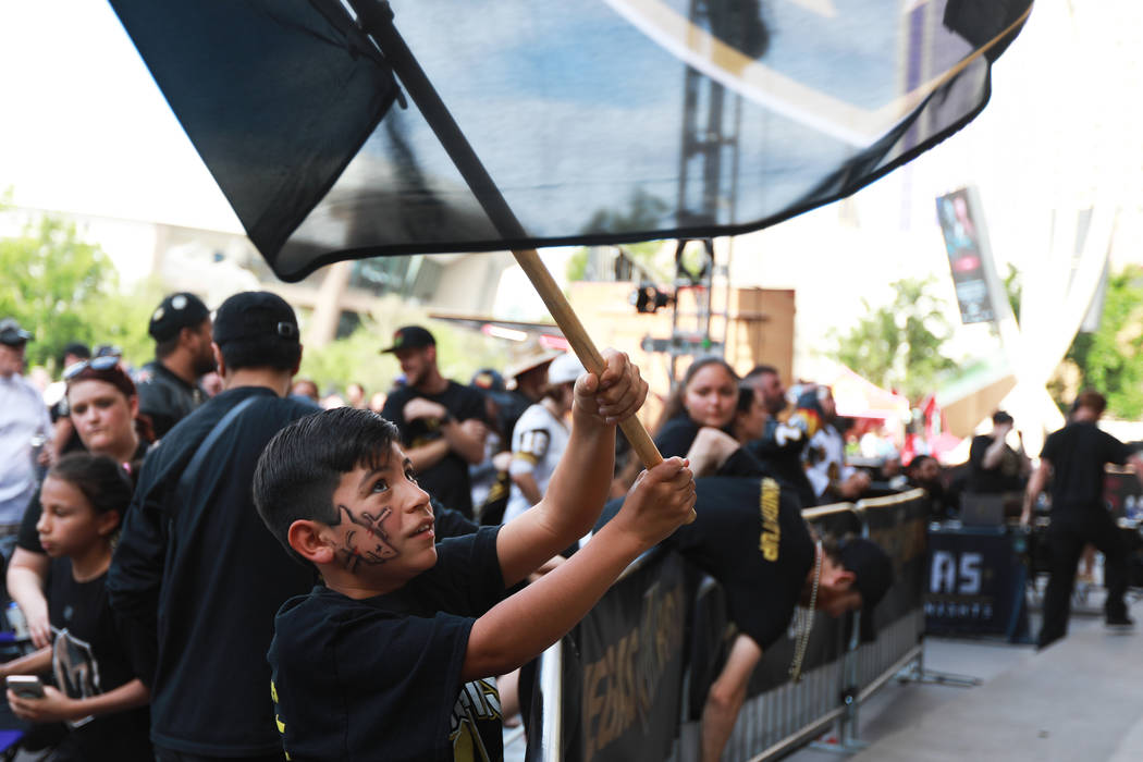 Daniel Arrieta, 9, waves a flag during a Vegas Golden Knights watch party for game six of the Stanley Cup playoffs outside on Toshiba Plaza in Las Vegas on Sunday, May 6, 2018. Andrea Cornejo Las ...