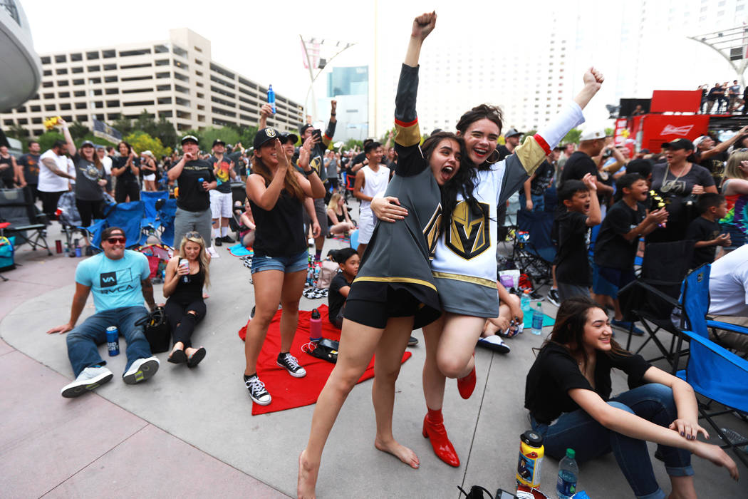 Alexis Salerno, 16, left, and her sister Gina, 18, both of Las Vegas, cheer after the Vegas Golden Knights scored a goal during a watch party for game six of the Stanley Cup playoffs outside on T ...