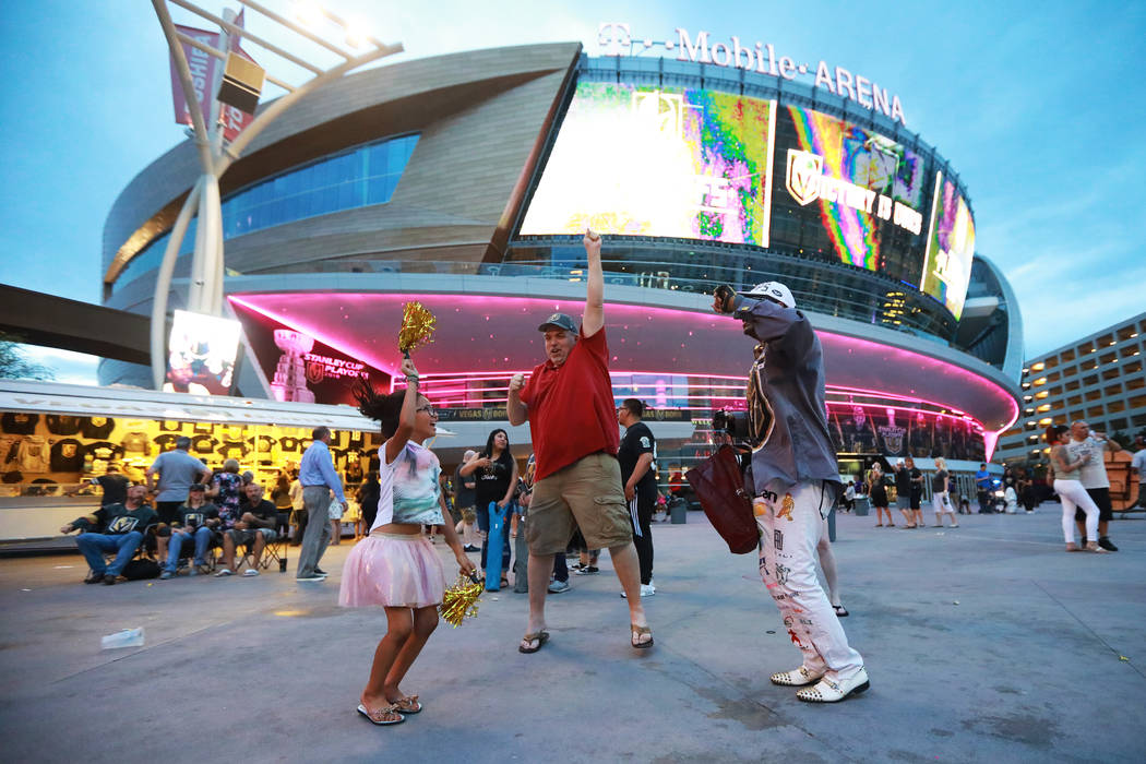 Fans celebrate after the Vegas Golden Knights defeated the San Jose Sharks during a watch party for game six of the Stanley Cup playoffs outside on Toshiba Plaza in Las Vegas on Sunday, May 6, 201 ...