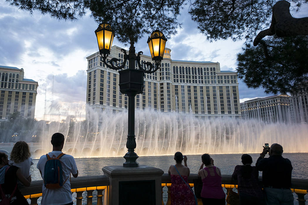 Tourists take in the fountains at the Bellagio in Las Vegas on Wednesday, Aug. 30, 2017. Chase Stevens Las Vegas Review-Journal @csstevensphoto