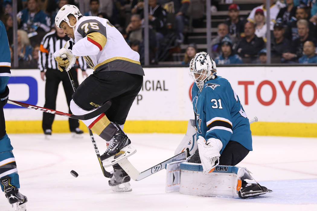 Vegas Golden Knights center William Karlsson (71) leaps out of the way as San Jose Sharks goaltender Martin Jones (31) defends his goal during the first period in Game 6 of an NHL hockey second-ro ...