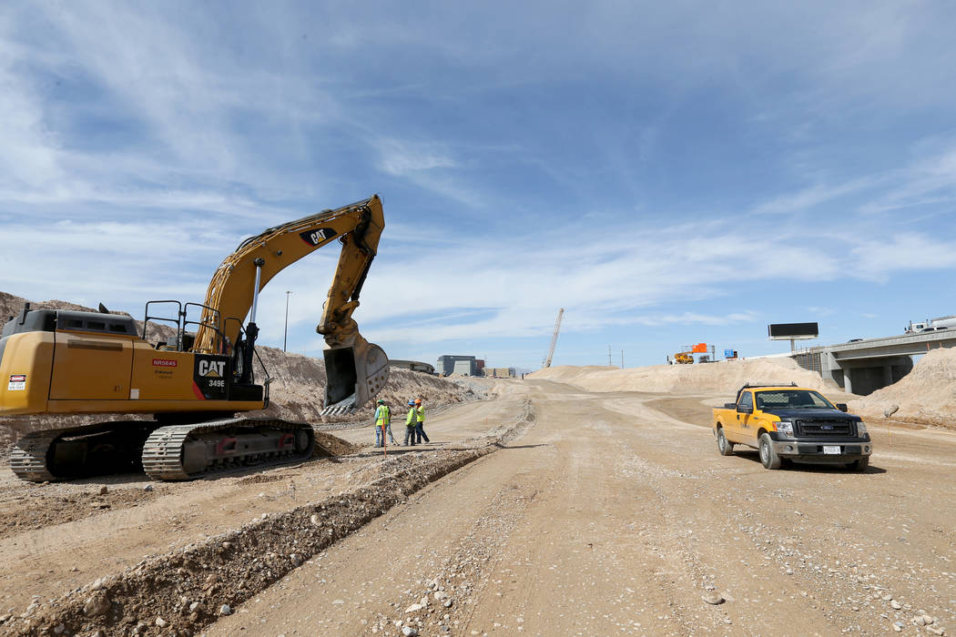 Work continues May, 8, 2018, on the high occupancy vehicle exit lanes to the Neon Gateway in downtown Las Vegas between what will be the northbound and southbound lanes of Interstate 15 as part of ...