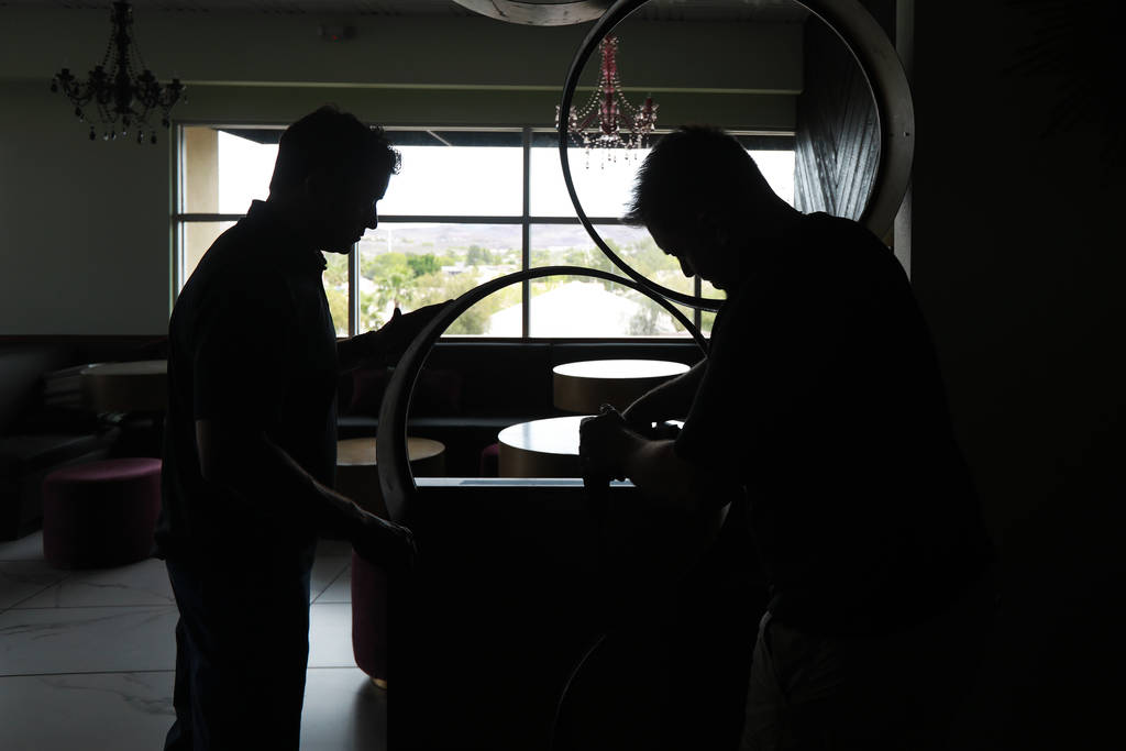 Antonio Nunez and Scott Commings set up decorations at The Stove, which is under construction, in Henderson, Nevada on Sunday, May 6, 2018. Andrea Cornejo Las Vegas Review-Journal @dreacornejo