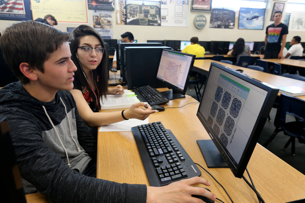 Rancho High School juniors Ethan Fleury and Dabne Anaya take practice tests for their Federal Aviation Administration private pilot certificate in class Wednesday, May 9, 2018. K.M. Cannon Las Veg ...