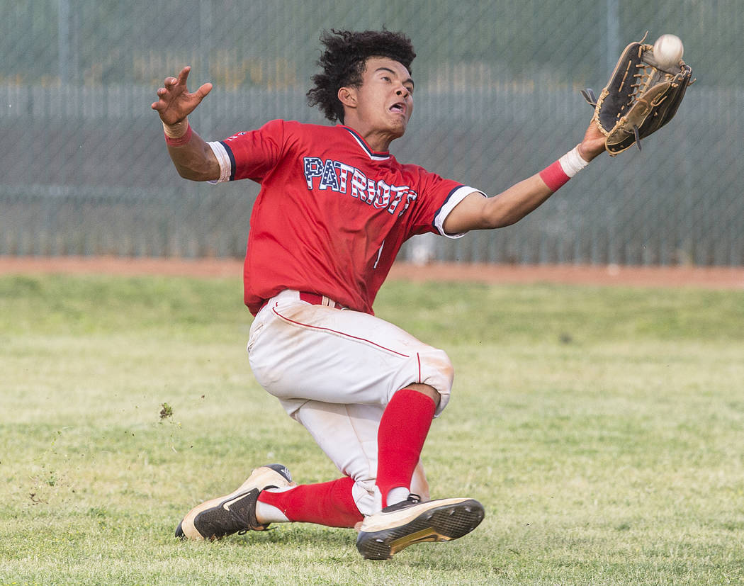 Liberty right fielder Mason Bowden (1) makes a diving catch in the sixth inning during the Patriots home matchup with Coronado High School during the opening round of the Sunrise Region baseball t ...