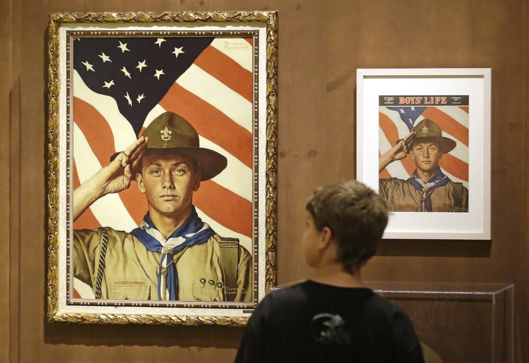 In this July 22, 2013, file photo, Andrew Garrison, 11, of Salt Lake City, looks over the Rockwell exhibition at the Mormon Church History Museum in Salt Lake City, Utah. Twenty-three original, Bo ...