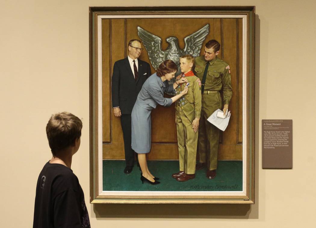 In this July 22, 2013, file photo, Andrew Garrison, 11, of Salt Lake City, looks over the Rockwell exhibition at the Mormon Church History Museum, in Salt Lake City, Utah. Twenty-three original, B ...