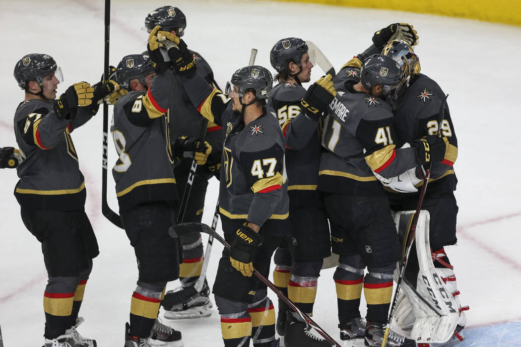 The Vegas Golden Knights celebrate their 5-3 victory over the San Jose Sharks following Game 5 of an NHL hockey second-round playoff series at T-Mobile Arena in Las Vegas on Friday, May 4, 2018. R ...