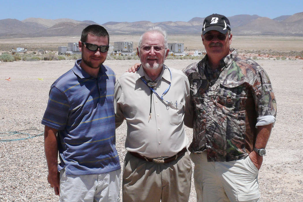 Robert Brownlee poses with his grandson Bobby, left, and son, Wayne, during a tour of Nevada Test Site.ʂrownlee, 94, died May 2 at his home in Loveland, Colorado. Family photo