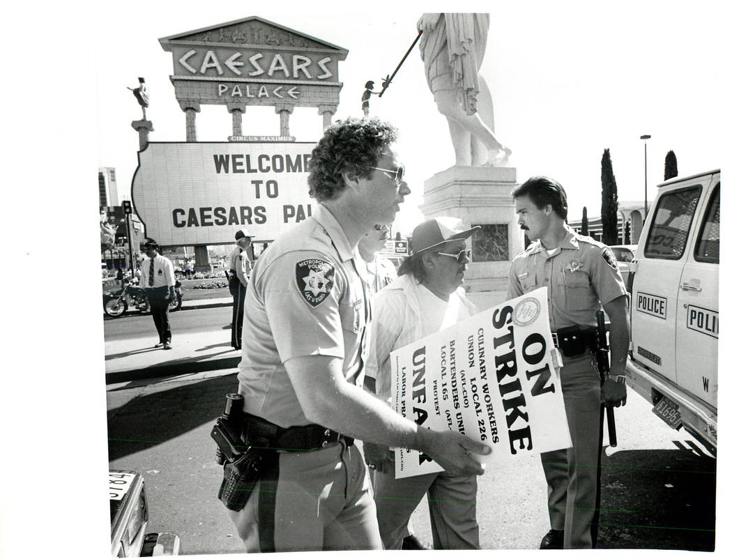 Labor: Culinary Union Strike 1984 - April 1984 Striker led away by police after he and two others were arrested for obstructing traffic at Caesars north entrance. (Scott Henry/Las Vegas Review-Jo ...