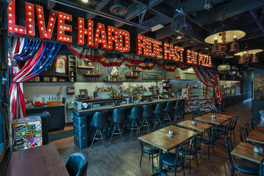 Evel Knievel memorabilia, like a pinball machine and a video game cabinet, fill Evel Pie a pizza restaurant, co-owned by Knievel's son Kelly Knievel and Branden Powers on Fremont Street in Las Veg ...