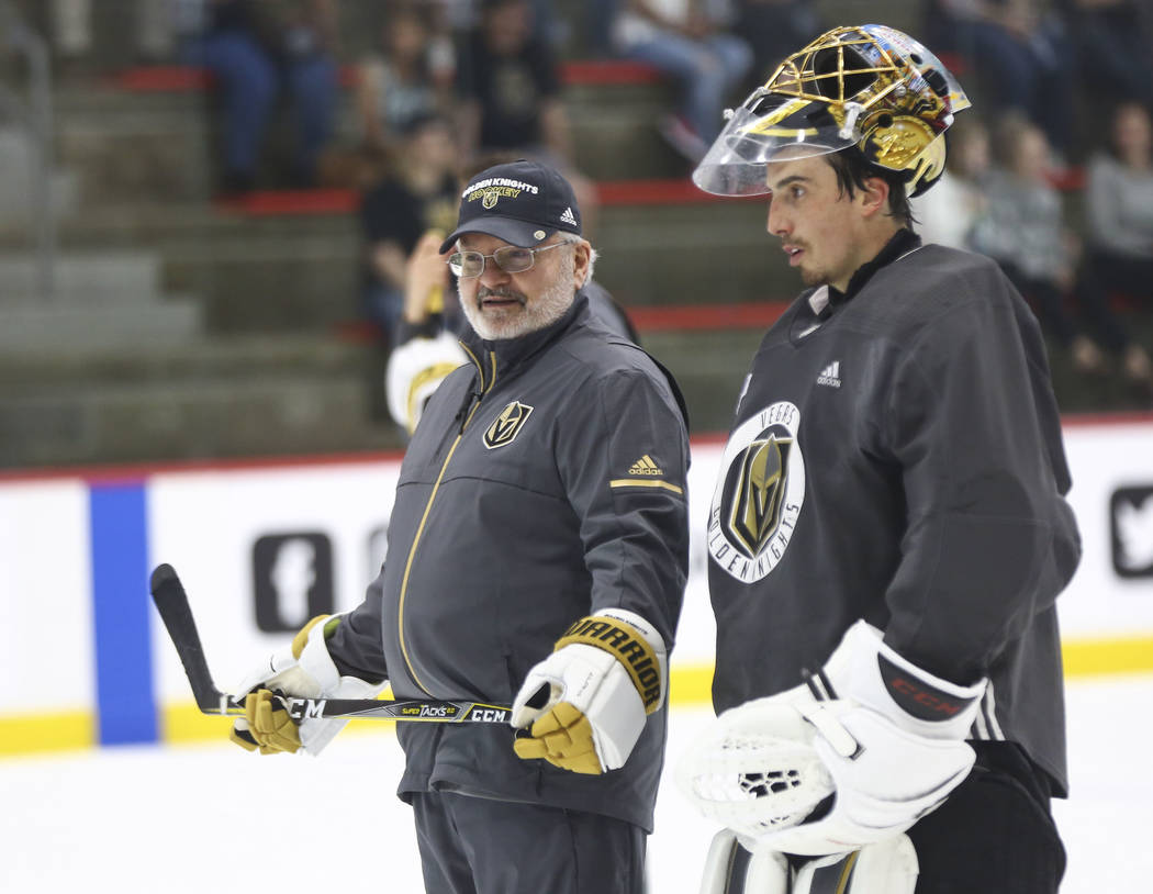 Golden Knights goaltending coach David Prior, left, talks with goaltender Marc-Andre Fleury during practice at City National Arena in Las Vegas on Thursday, May 10, 2018. Chase Stevens Las Vegas R ...