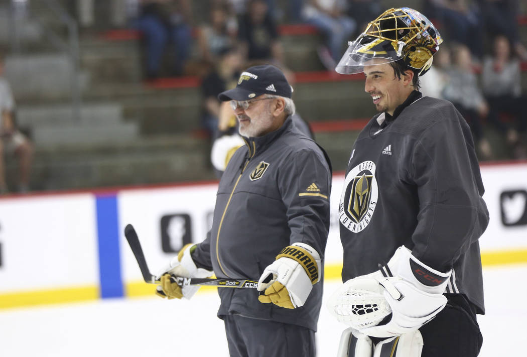 Golden Knights goaltending coach David Prior, left, talks with goaltender Marc-Andre Fleury during practice at City National Arena in Las Vegas on Thursday, May 10, 2018. Chase Stevens Las Vegas R ...