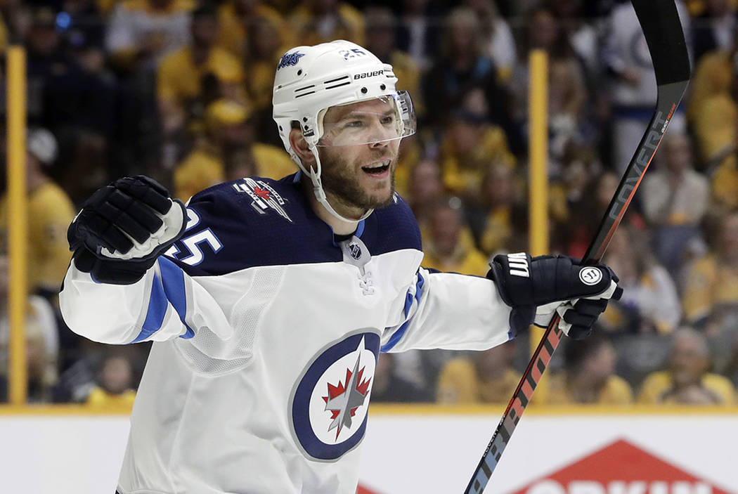 Winnipeg Jets center Paul Stastny celebrates after teammate Tyler Myers scored a goal against the Nashville Predators during the first period in Game 7 of an NHL hockey second-round playoff series ...