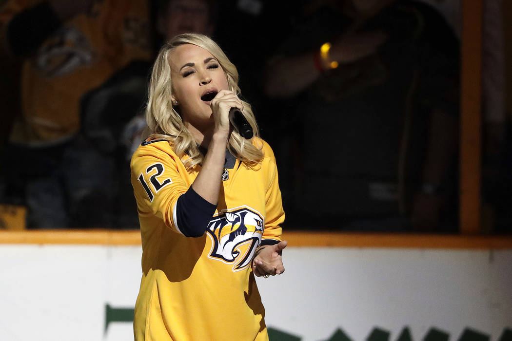 Carrie Underwood sings the national anthem before Game 2 of an NHL hockey second-round playoff series between the Nashville Predators and the Winnipeg Jets Monday, April 30, 2018, in Nashville, Te ...