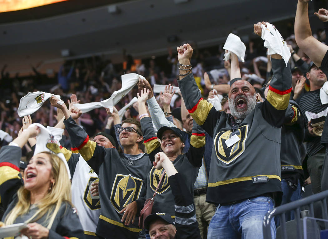 Golden Knights fans celebrate a goal by Alex Tuch, not pictured, during the second period of Game 5 of an NHL hockey second-round playoff series against the San Jose Sharks at T-Mobile Arena in La ...