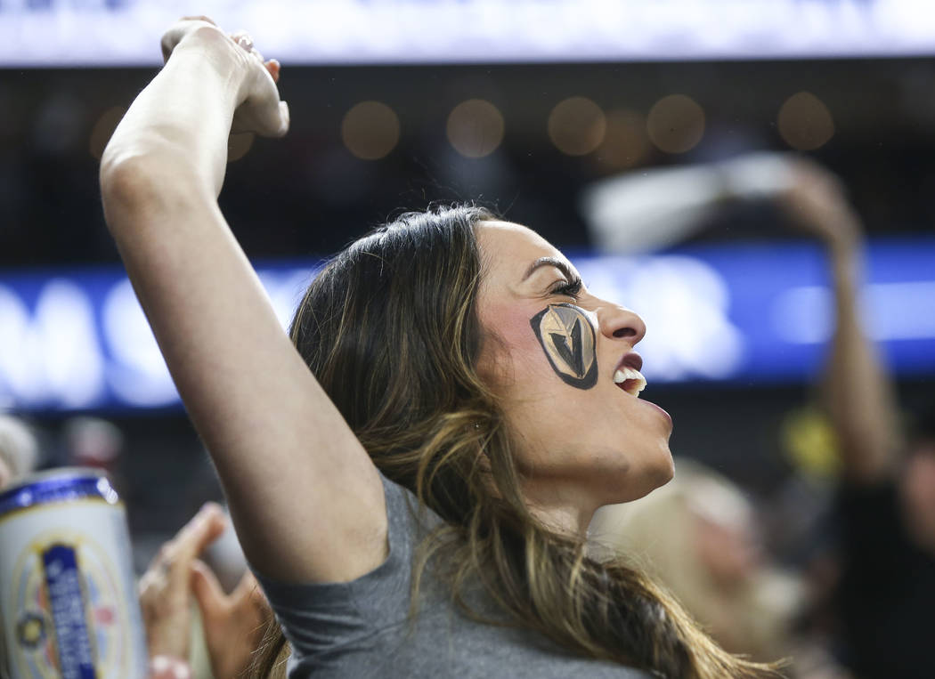 Golden Knights fans celebrate a goal by Alex Tuch, not pictured, during the second period of Game 5 of an NHL hockey second-round playoff series against the San Jose Sharks at T-Mobile Arena in La ...