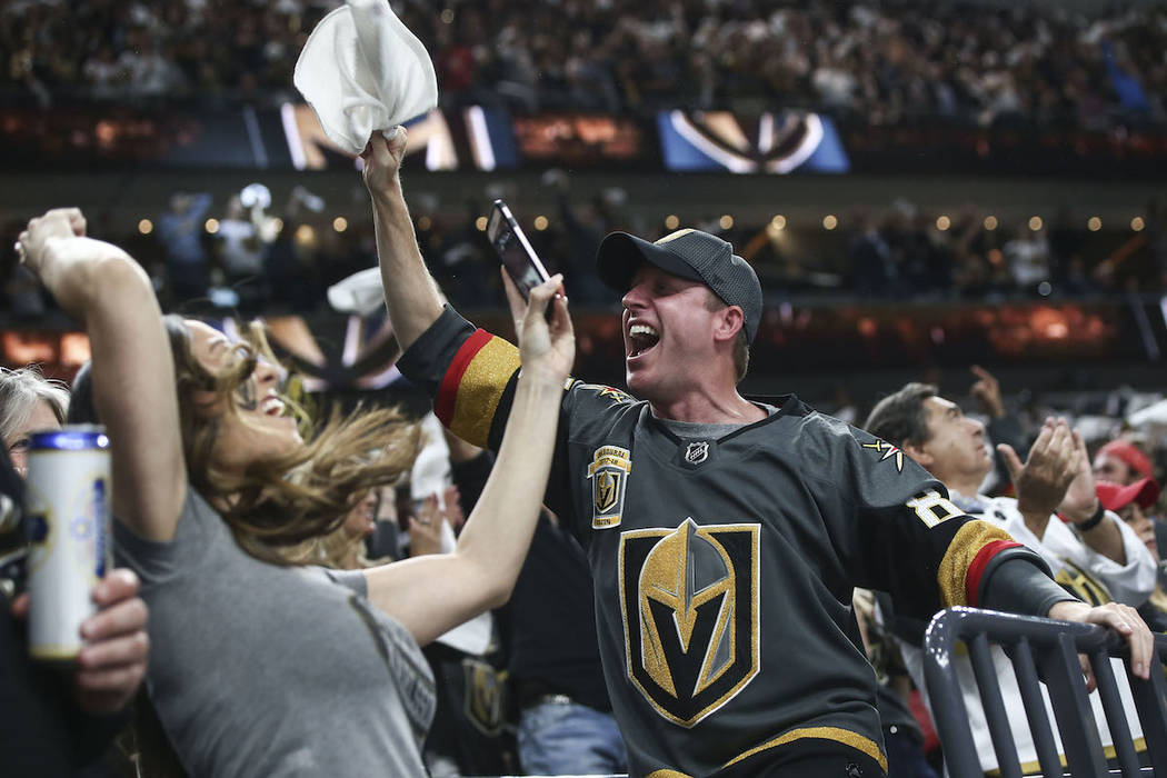 Golden Knights fans celebrate a goal by Golden Knights left wing James Neal, not pictured, against the San Jose Sharks during the first period of Game 5 of an NHL hockey second-round playoff serie ...