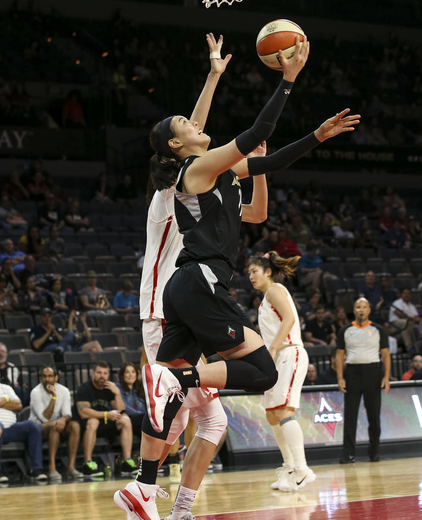 Las Vegas Aces center Ji-Su Park (19)goes up for a shot against China's Zhengi Pan (17) during a preseason basketball game at Mandalay Bay Events Center in Las Vegas on Sunday, May 6, 2018. Richar ...