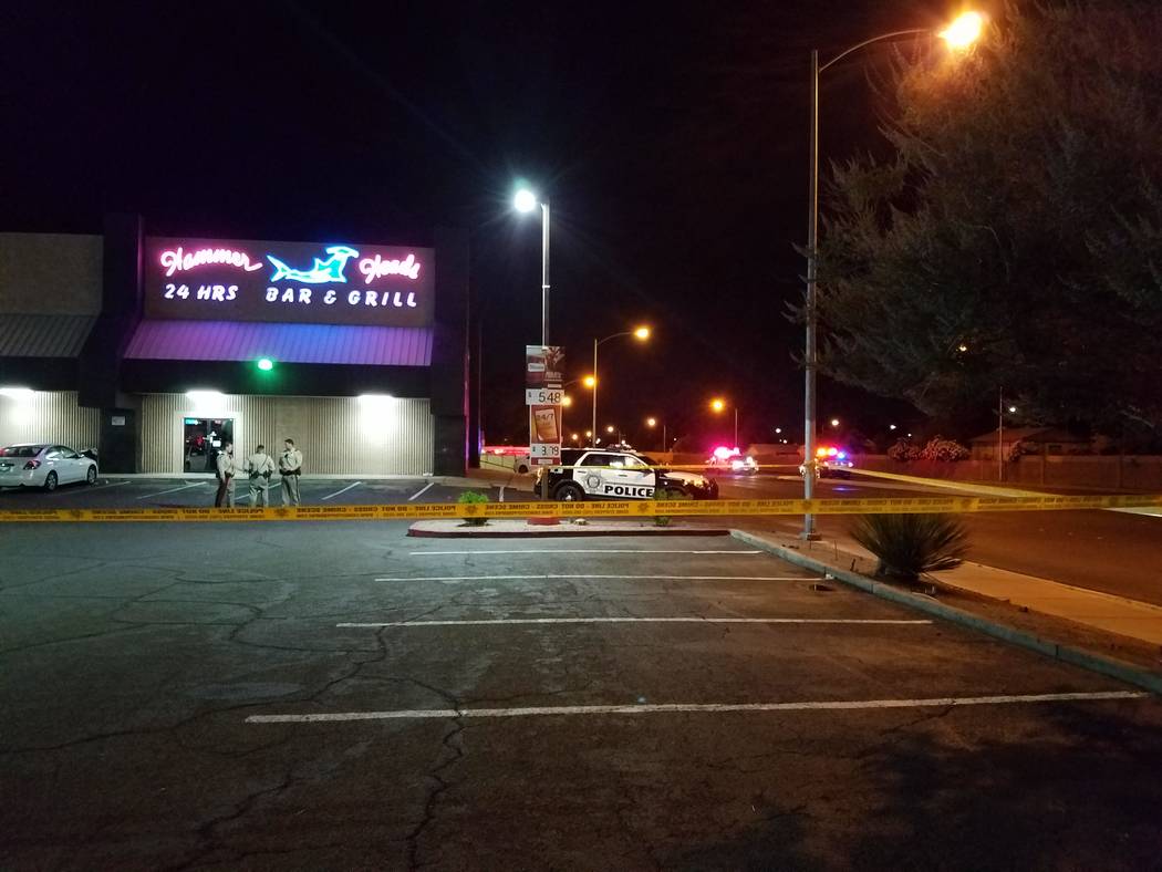 Metropolitan Police Department officers talk with one another at a location not far from the scene of an officer-involved shooting Saturday night on Big Sur Drive in the east Las Vegas Valley. (Mi ...