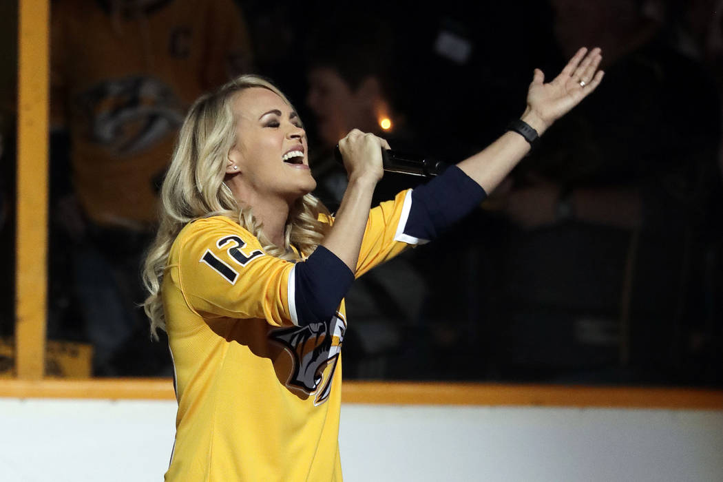 Carrie Underwood sings the national anthem before Game 2 of an NHL hockey second-round playoff series between the Nashville Predators and the Winnipeg Jets Monday, April 30, 2018, in Nashville, Te ...
