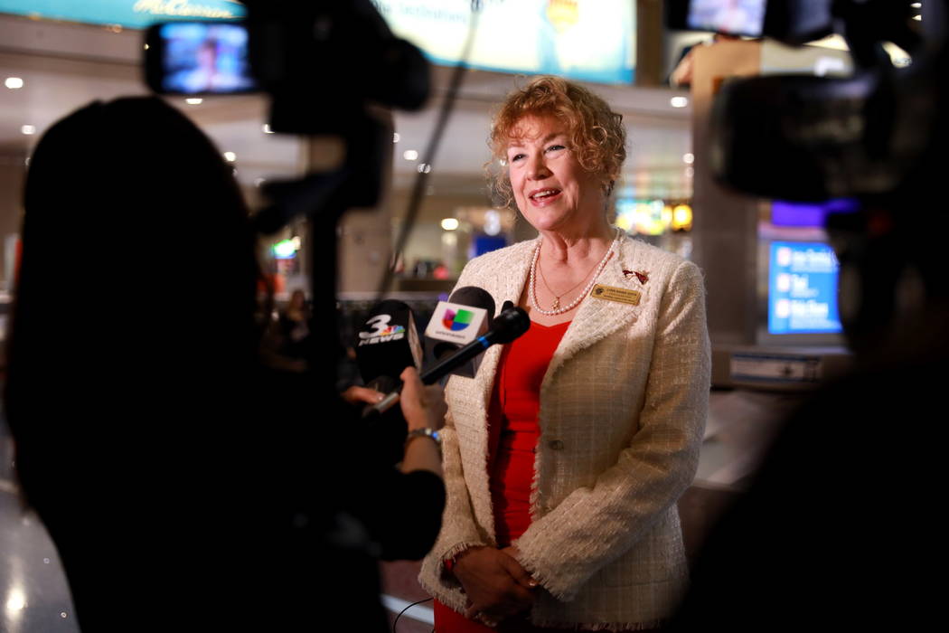 Lynn Goya, Clark County clerk, talks about services at the temporary wedding license office at McCarran International Airport in Las Vegas, Thursday, Feb. 8, 2018. (Andrea Cornejo/Las Vegas Review ...