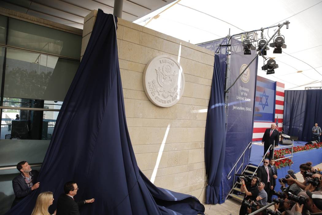 U.S. President Donald Trump's daughter Ivanka Trump, left, and U.S. Treasury Secretary Steve Mnuchin unveil an inauguration plaque during the opening ceremony of the new US embassy in Jerusalem, M ...