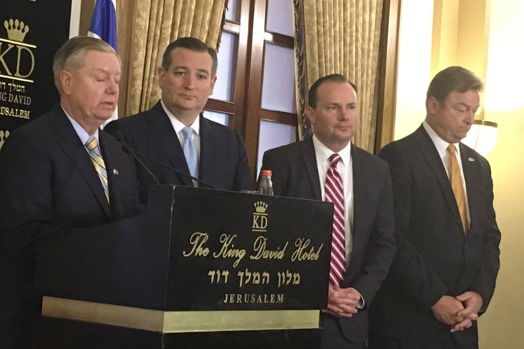 From left, U.S. Sens. Lindsey Graham, R-S.C., Ted Cruz, R-Texas, Mike Lee, R-Utah, and Dean Heller, R-Nev., speak during a press conference at the King David Hotel in Jerusalem, Monday, May 14, 20 ...