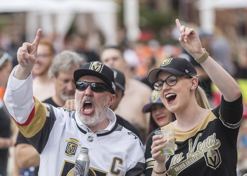 Golden Knights fans Brian Matherly, left, and Jennifer Hendowski cheer at a watch party at Red Rock Casino during Vegas' game two NHL Western Conference Finals road matchup with the Winnipeg Jets ...
