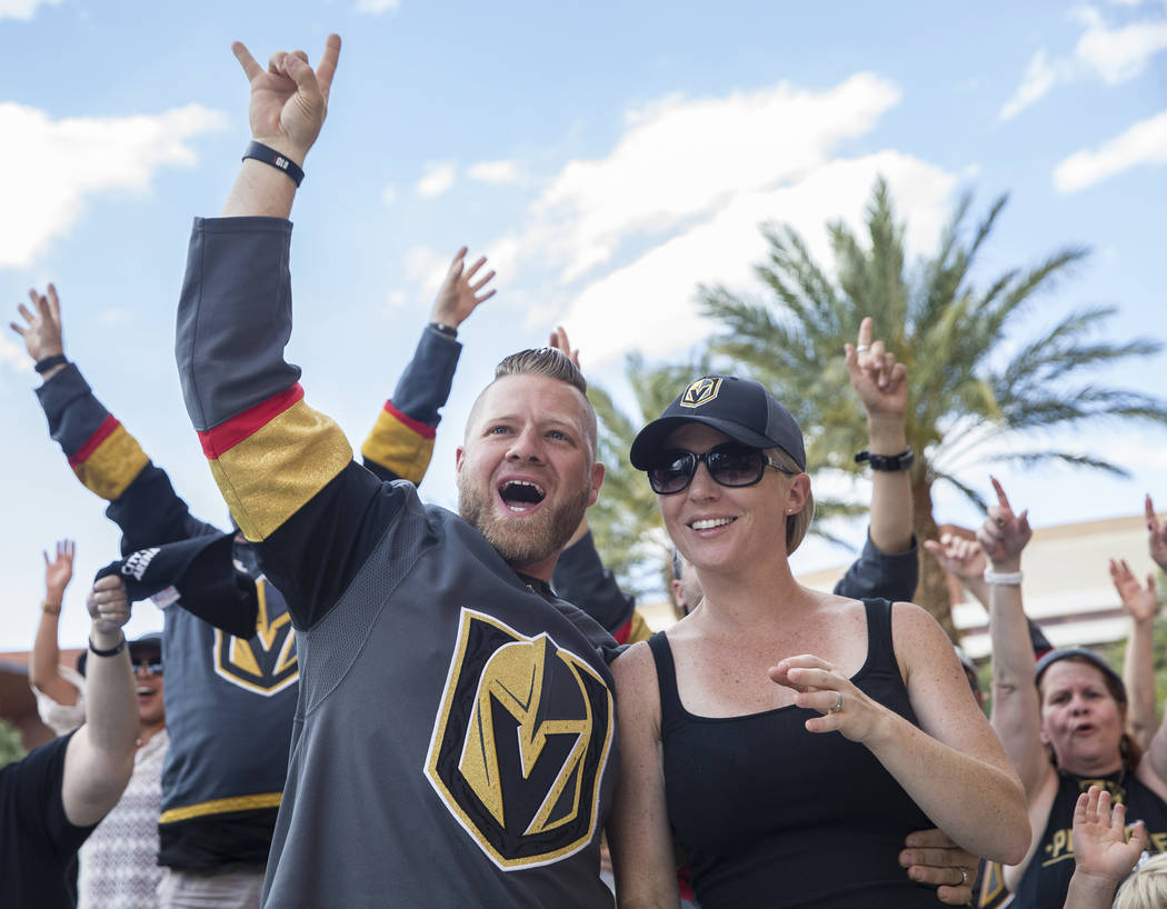 Golden Knights fans Eric and Jen Eierdam cheer at a watch party at Red Rock Casino during Vegas' game two NHL Western Conference Finals road matchup with the Winnipeg Jets on Monday, May 14, 2018, ...